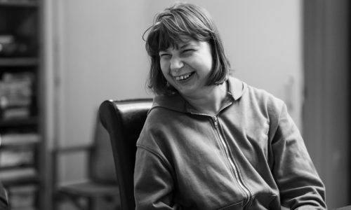 Greyscale photo of a woman with intellectual disability.