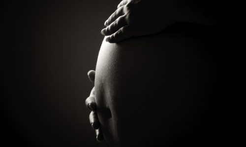 Greyscale photo of pregnant woman.