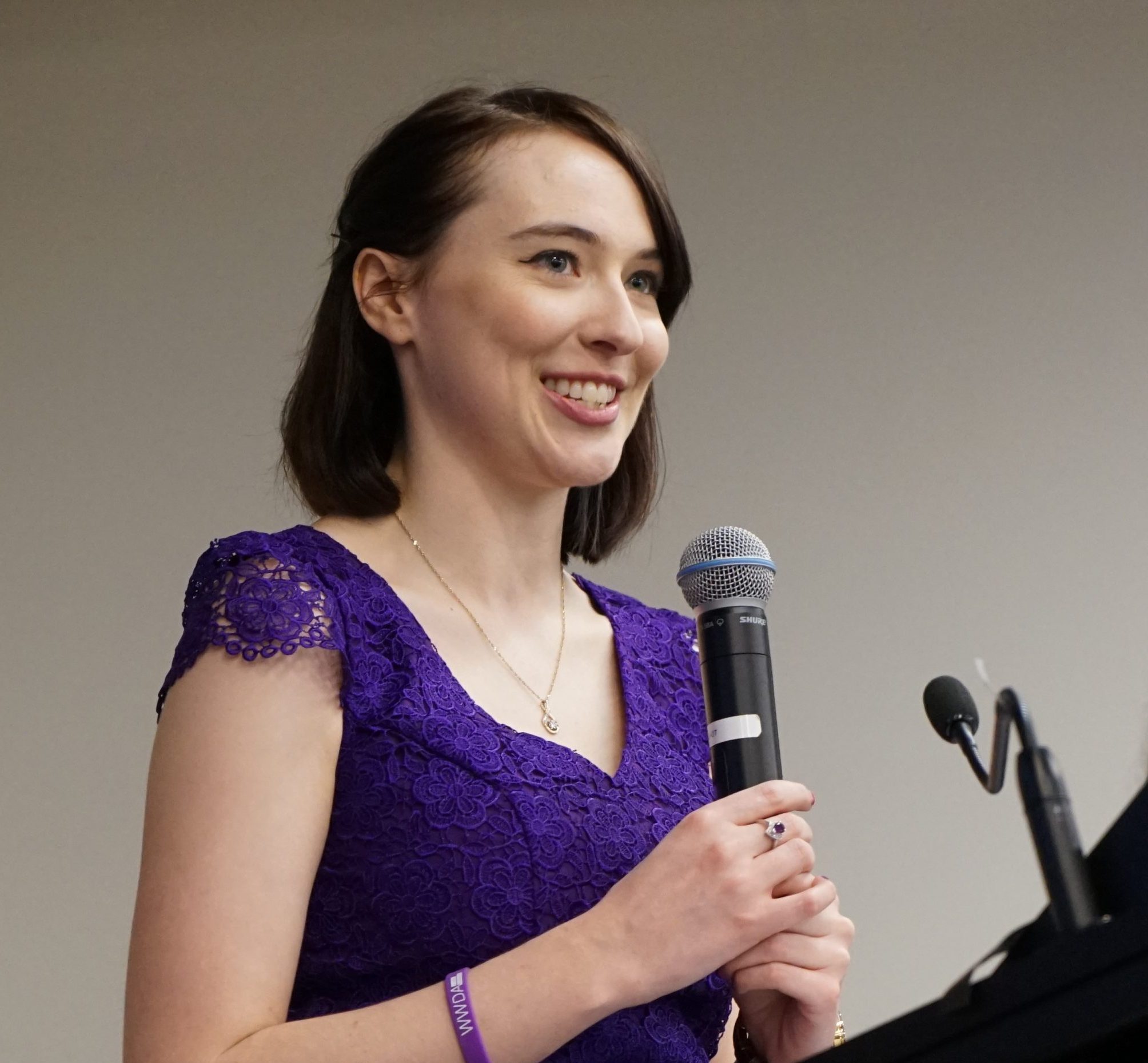 Photo of Cashelle Dunn, Young woman with disability, speaking into a microphone about the WWDA Youth Network.