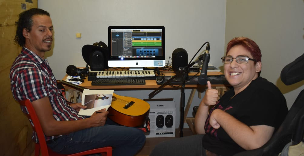 Photo of Steve Carillo and Amy James working on Amy’s music compilations.