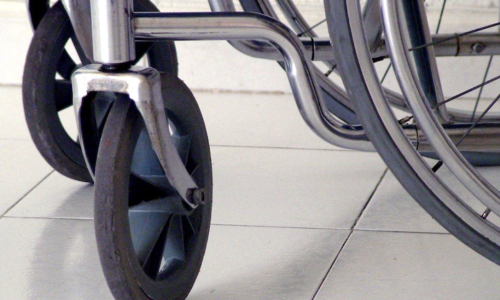 A wheelchair on a tile floor