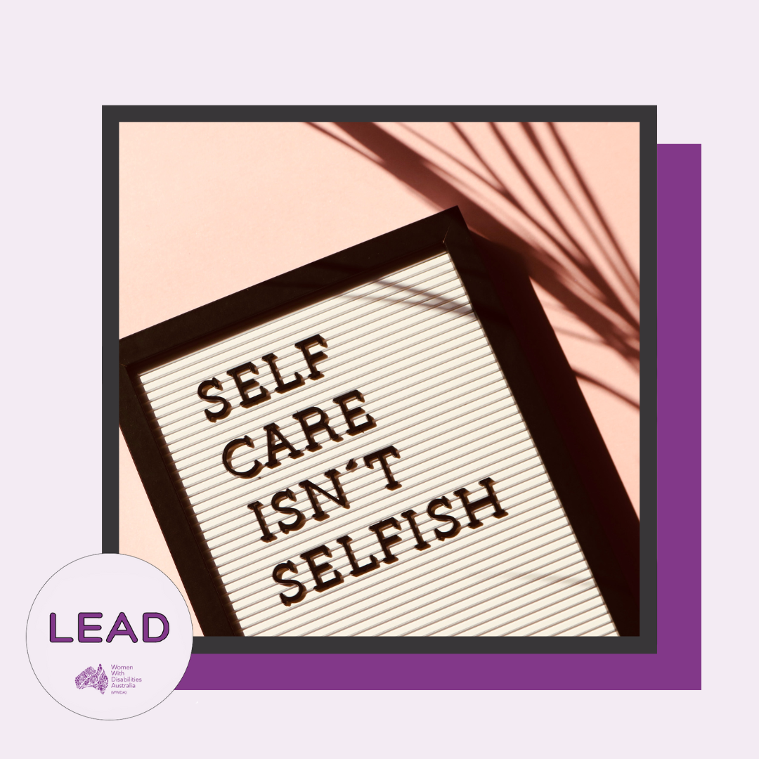 Light purple background with a dark purple shadow, the photo has a black border, the LEAD logo is in the bottom left-hand corner and text says ‘LEAD Women With Disabilities Australia (WWDA)’, the photo is of a poster with text that reads ‘Self-care isn’t selfish