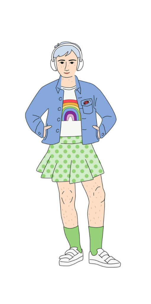 A woman in a shirt green skirt, a rainbow tshirt, and a denim jacket.